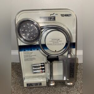 Master Forge LED grill light with a flexible arm,